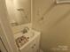Bathroom features a white sink and mirror, awaiting personal touches at 5924 Freedom Dr, Charlotte, NC 28214