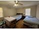 Well-lit bedroom featuring two beds, and hardwood floors at 5924 Freedom Dr, Charlotte, NC 28214