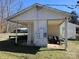 Carport with lawnmower parked inside, offers convenient storage space at 5924 Freedom Dr, Charlotte, NC 28214