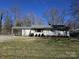 Cozy single-story home with a well-maintained lawn and exterior at 5924 Freedom Dr, Charlotte, NC 28214