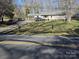 Street view of home with carport on a sunny day at 5924 Freedom Dr, Charlotte, NC 28214