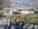 View of home with paved driveway and a carport at 5924 Freedom Dr, Charlotte, NC 28214
