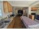 Eat-in kitchen setup with sink, cabinetry, and open view to another dining area at 5924 Freedom Dr, Charlotte, NC 28214