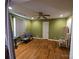 Living area with hardwood floors and natural light from the window at 5924 Freedom Dr, Charlotte, NC 28214