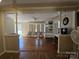 Hardwood floors, ceiling fan and natural light in this living room at 5924 Freedom Dr, Charlotte, NC 28214