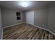 Clean bedroom with modern flooring and a spacious closet at 6756 Denver Heights Cir, Denver, NC 28037