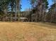 Expansive plot of land surrounded by mature trees, offering privacy and a serene natural setting at 6756 Denver Heights Cir, Denver, NC 28037