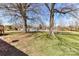 Spacious backyard with mature trees offering plenty of space for outdoor activities and enjoyment at 7770 Sherrills Ford Rd, Sherrills Ford, NC 28673