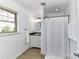 Clean bathroom featuring granite countertop, white vanity and shower with curtain at 7770 Sherrills Ford Rd, Sherrills Ford, NC 28673