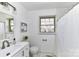 Bathroom featuring vanity with integrated sink and shower with white tiling and curtain at 7770 Sherrills Ford Rd, Sherrills Ford, NC 28673