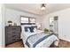Inviting bedroom featuring warm natural light, wood floors, and a view to an ensuite bathroom at 7770 Sherrills Ford Rd, Sherrills Ford, NC 28673