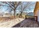 A wooden deck overlooking the yard provides outdoor living space perfect for entertaining and relaxation at 7770 Sherrills Ford Rd, Sherrills Ford, NC 28673