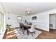 Elegant dining room with hardwood floors, decorative trim, and a stylish chandelier at 7770 Sherrills Ford Rd, Sherrills Ford, NC 28673