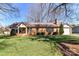 Charming single-story brick home with a well-manicured lawn and mature trees in a peaceful neighborhood at 7770 Sherrills Ford Rd, Sherrills Ford, NC 28673