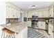 Well-equipped kitchen features stainless steel appliances, ample storage, granite countertops, and bar seating at 7770 Sherrills Ford Rd, Sherrills Ford, NC 28673