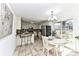 Open kitchen and dining area with a breakfast bar, white cabinetry and stainless steel appliances at 7770 Sherrills Ford Rd, Sherrills Ford, NC 28673