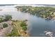 Aerial view of lakeside community with boardwalk and boat docks on the water at 8123 Village Harbor Dr, Cornelius, NC 28031
