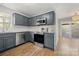 Modern kitchen with stainless steel appliances and a window overlooking a deck at 9007 St Croix Ln, Charlotte, NC 28277