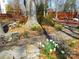 Stone-lined walkway leading to a backyard seating area surrounded by flowers and landscaping at 9331 Hanworth Trace Dr, Charlotte, NC 28277
