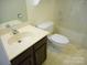 Standard bathroom with vanity, toilet, and shower-tub combo, complete with neutral finishes and classic design at 9331 Hanworth Trace Dr, Charlotte, NC 28277
