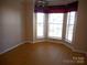 Dining area with bay window and modern lighting fixture at 9331 Hanworth Trace Dr, Charlotte, NC 28277