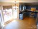 Bright kitchen with blue cabinets, wood floors, and stainless appliances at 9331 Hanworth Trace Dr, Charlotte, NC 28277