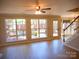 Open floor plan living room with access to deck and stairwell at 9331 Hanworth Trace Dr, Charlotte, NC 28277