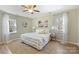 Relaxing bedroom with a large window and warm paint colors at 9505 Kent Village Dr, Charlotte, NC 28269