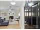 Bright living room featuring fireplace and a modern ceiling fan at 9505 Kent Village Dr, Charlotte, NC 28269