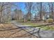 Charming home nestled in a serene neighborhood with a picturesque street and well-maintained landscaping at 9505 Kent Village Dr, Charlotte, NC 28269