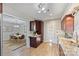 Well-lit kitchen features granite countertops, wood floors, and modern stainless steel sink at 9505 Kent Village Dr, Charlotte, NC 28269