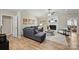 Comfortable living area with a cozy fireplace, plush sofa, and bright natural light from large windows at 9505 Kent Village Dr, Charlotte, NC 28269