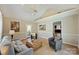 Bright living room with vaulted ceilings, ceiling fan, neutral paint, and lots of natural light at 9505 Kent Village Dr, Charlotte, NC 28269