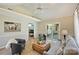 Bright living room with vaulted ceilings, ceiling fan, neutral paint, and access to deck at 9505 Kent Village Dr, Charlotte, NC 28269