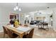 Open concept living space with the dining room, living room, and kitchen with hardwood flooring at 9505 Kent Village Dr, Charlotte, NC 28269