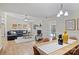 Open floor plan with a living room and dining room featuring hardwood floors and lots of light at 9505 Kent Village Dr, Charlotte, NC 28269