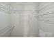 Walk-in closet has built-in storage for organization at 9505 Kent Village Dr, Charlotte, NC 28269