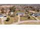 Aerial view of a property with a driveway, pool, and surrounding landscape at 111 Lynnette Dr, Mt Ulla, NC 28125