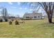Spacious backyard with a lush lawn, offering plenty of room for gardening, recreation, and enjoying the outdoors at 111 Lynnette Dr, Mt Ulla, NC 28125