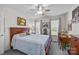 Bedroom with a bed and side tables, natural light from two windows, ceiling fan and a desk with chair at 111 Lynnette Dr, Mt Ulla, NC 28125