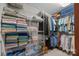 Organized walk-in closet featuring metal shelving and racks for clothes, shoes, and folded linens at 111 Lynnette Dr, Mt Ulla, NC 28125