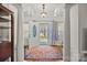 Elegant foyer with soaring ceilings, decorative columns, and an open doorway, welcoming you into a bright, spacious home at 111 Lynnette Dr, Mt Ulla, NC 28125
