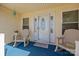 Inviting front porch with a decorative front door and rocking chairs at 111 Lynnette Dr, Mt Ulla, NC 28125