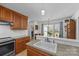 This well-appointed kitchen offers wood cabinets, granite counters, and stainless steel oven at 111 Lynnette Dr, Mt Ulla, NC 28125