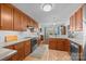 Inviting kitchen features wood cabinets, granite counters, stainless steel appliances, and an adjacent breakfast nook at 111 Lynnette Dr, Mt Ulla, NC 28125