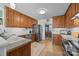 Bright kitchen boasts wood cabinets, granite counters, stainless steel appliances, and opens to the dining room at 111 Lynnette Dr, Mt Ulla, NC 28125