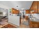Spacious kitchen with wood cabinets, modern appliances, and a view into the dining room at 111 Lynnette Dr, Mt Ulla, NC 28125