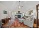 Bright living room featuring a fireplace, vaulted ceilings and abundant natural light from double doors at 111 Lynnette Dr, Mt Ulla, NC 28125