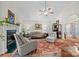 Cozy living room with a fireplace, lots of natural light, and comfortable seating on a large rug at 111 Lynnette Dr, Mt Ulla, NC 28125