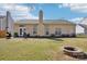 Large backyard with a fire pit and outdoor space perfect for entertaining at 14429 Planters Knob Ln, Charlotte, NC 28273
